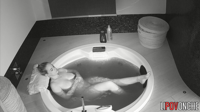 Busty blonde relaxes in hot jacuzzi and thinks about having sex later