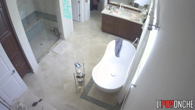 Rich lady with beautiful brests gets ready in a big bathroom