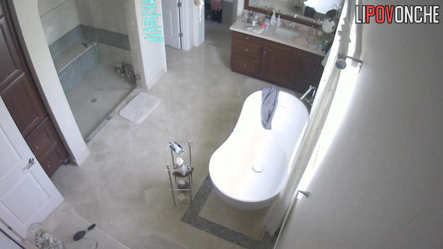 Rich lady with beautiful brests gets ready in a big bathroom