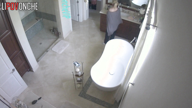 Rich lady with beautiful brests gets ready in a big bathroom