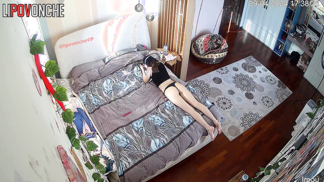 Young boyfriend and girlfriend relaxing in the bedroom