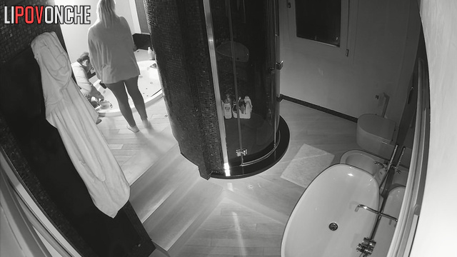 A bored naked blonde takes a hot bath in a jacuzzi before peeing