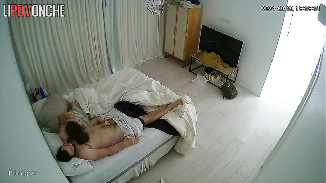 A bored brunette slowly plays with her bearded husband's big cock