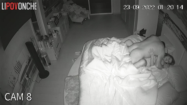 A man plays with his wife's large breasts, licking her delicate nipples