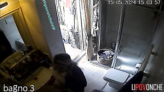 A mature blonde admires her sexy body in the mirror after peeing