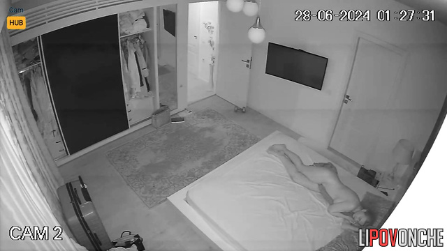 Naked cutie with a beautiful butt does yoga in her bedroom before bed