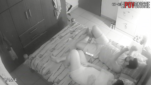 A bearded man inserts a vibrator into his wife's vagina while she plays with his cock