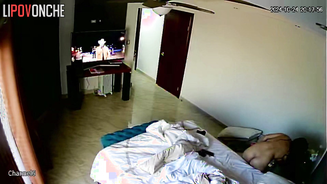 Long-haired beauty with big tits put a vibrator to her cunt while relaxing in bed