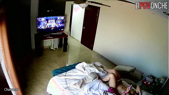 Long-haired beauty with big tits put a vibrator to her cunt while relaxing in bed