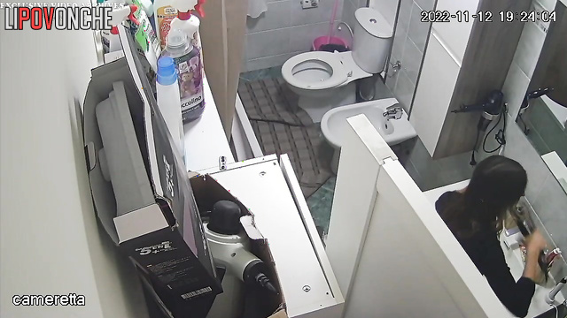 Two seductive sisters take turns peeing in the toilet in front of each other
