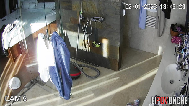 A gorgeous milf languidly wipes her seductive body after a shower