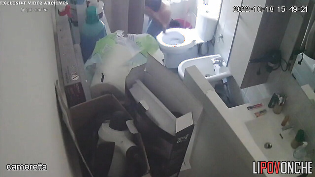 A slim, cute girl takes off her tight jeans and pees in the toilet