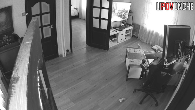 A bearded man actively plays with his cock while watching sex videos with his mistress