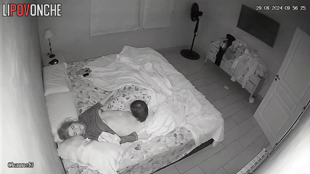 The husband slips his hands under his wife's panties, eagerly licking her nipples