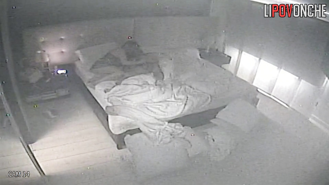 A beauty in a sexy nightgown lifts her husband's penis with her playful fingers