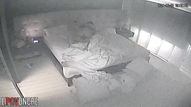 A beauty in a sexy nightgown lifts her husband's penis with her playful fingers