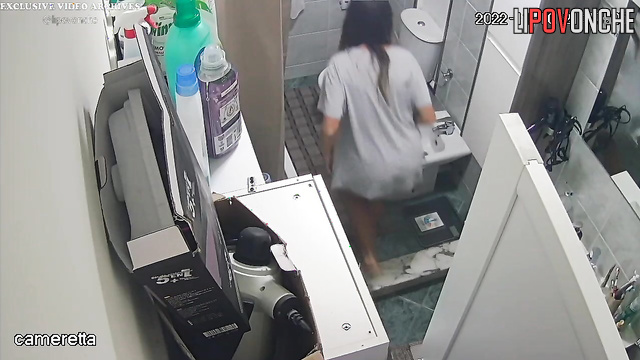 A seductive beauty with an inviting butt takes off her sexy panties to pee