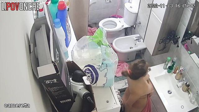 A tender cutie languidly undresses her sister with a hairy pussy for a shower