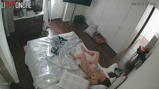 Bored mommy generously lubricates her hairy pussy before masturbating