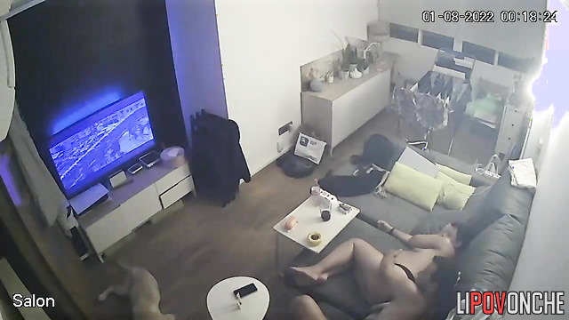Pregnant beauty watches a new movie wearing only thin panties