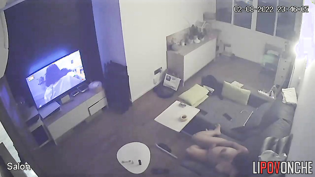 A seductive pregnant mom with big nipples on her sexy tits watches TV naked