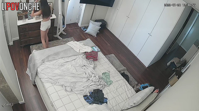 Long-haired student with small tits dances topless in front of the mirror