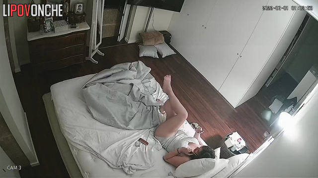 Young babe talking on the phone and touching her pussy
