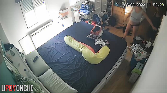 Pregnant lady and her mother are chatting in a room
