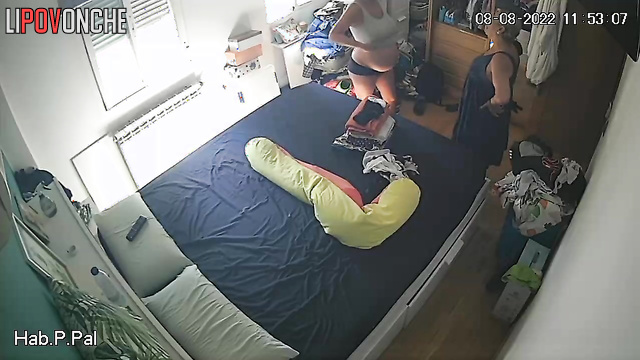 Pregnant lady and her mother are chatting in a room