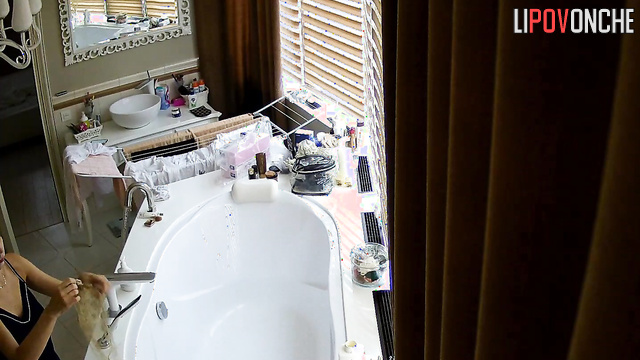 Skinny lady is going to take a bath, hidden camera