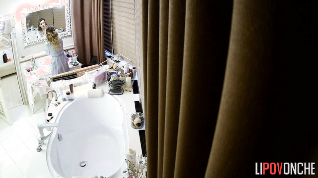 Skinny lady is going to take a bath, hidden camera