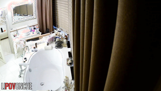 Skinny lady is going to take a bath, hidden camera