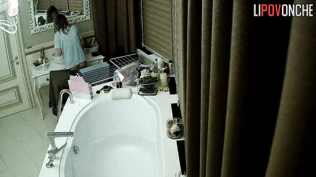 Beauty brushing her teeth in a luxurious bathroom