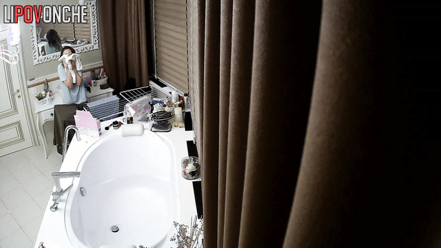 Beauty brushing her teeth in a luxurious bathroom