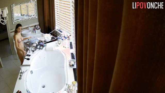 Beauty walks around the bathroom naked and gets nervous