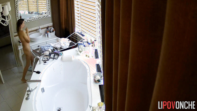 Beauty walks around the bathroom naked and gets nervous