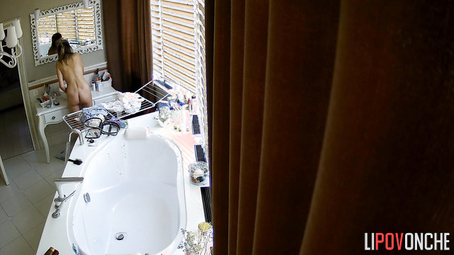 Beauty walks around the bathroom naked and gets nervous