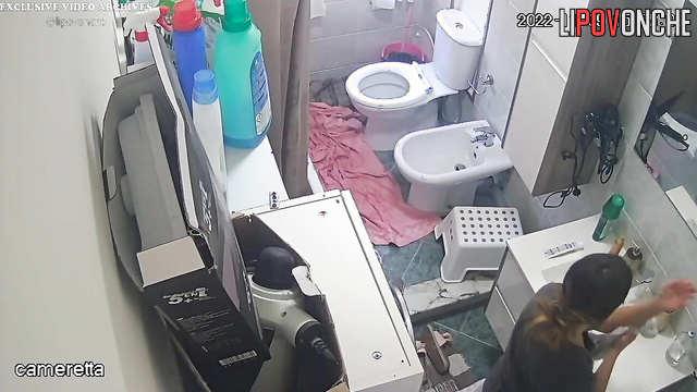 Sexy girl dries her naked lesbian girlfriend's hair with a hair dryer after a shower