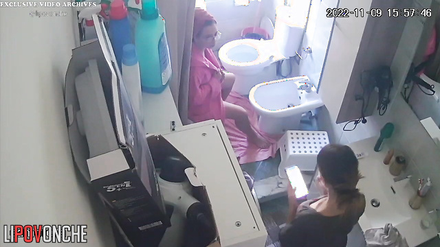 Sexy girl dries her naked lesbian girlfriend's hair with a hair dryer after a shower