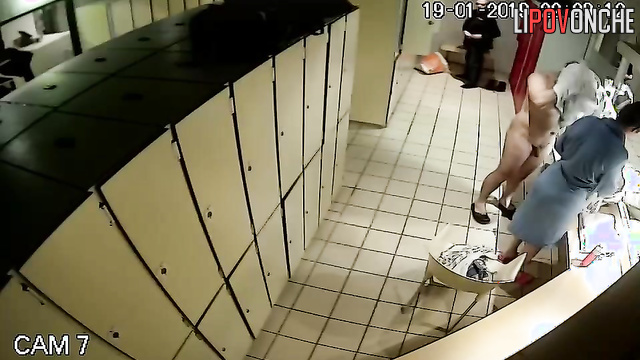 Strangers changing clothes in a public locker room