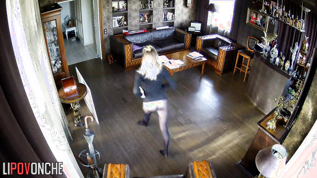 Young skinny beauty dancing alone in the living room