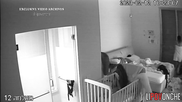 Young mommy gets herself ready for sleeping (video from bedroom)