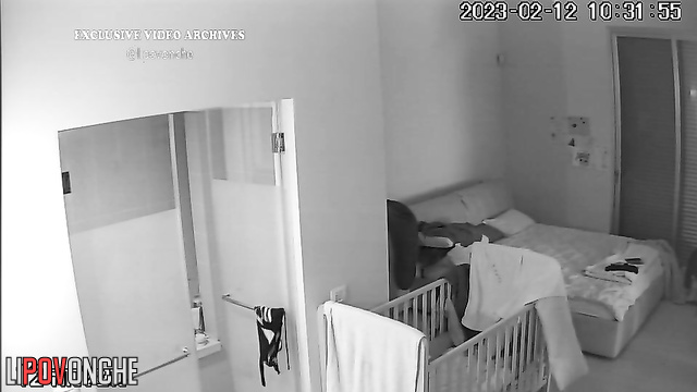 Young mommy gets herself ready for sleeping (video from bedroom)