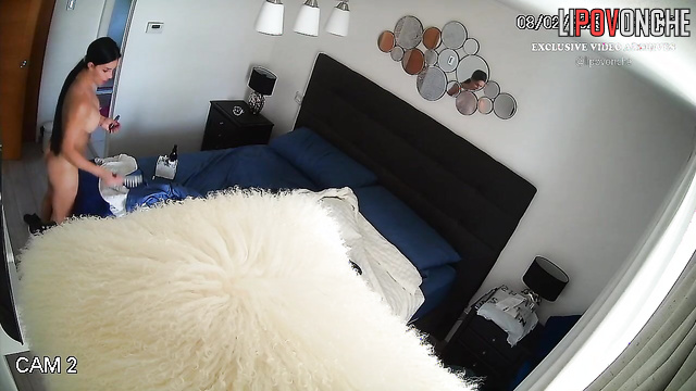 A busty cutie with long hair is bored naked while watching TikTok