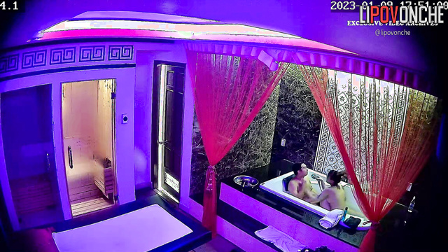 Tattooed Asian woman gives a sexy body massage to a client at Soapland