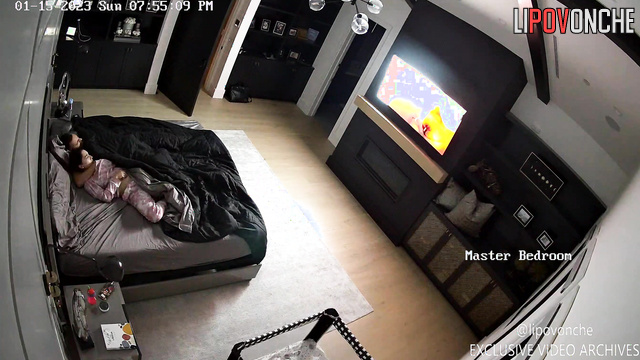 Brunette housewife gives her husband a hot blowjob while he watches TV