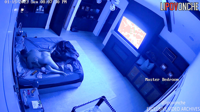 Brunette housewife gives her husband a hot blowjob while he watches TV