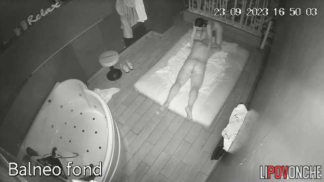 Naked slim cutie with inviting tits gives a body massage to an older man