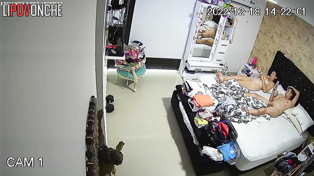 Spouses relaxing completely naked on the bed, spy cam