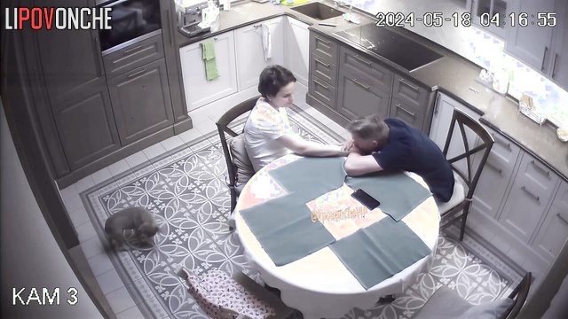 Husband and wife kissing and hugging topless at the kitchen